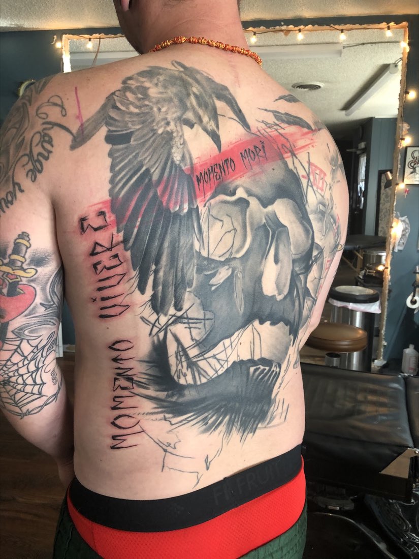 A client's large back piece, photographed inside the studio